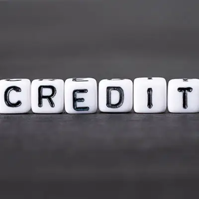 Image of dice spelling the word CREDIT
